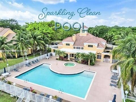 2667 NW 33rd Street, #2413, Oakland Park, Oakland Park, FL 33309 Community swimming pool with integrated spa, concrete deck, and perimeter fencing