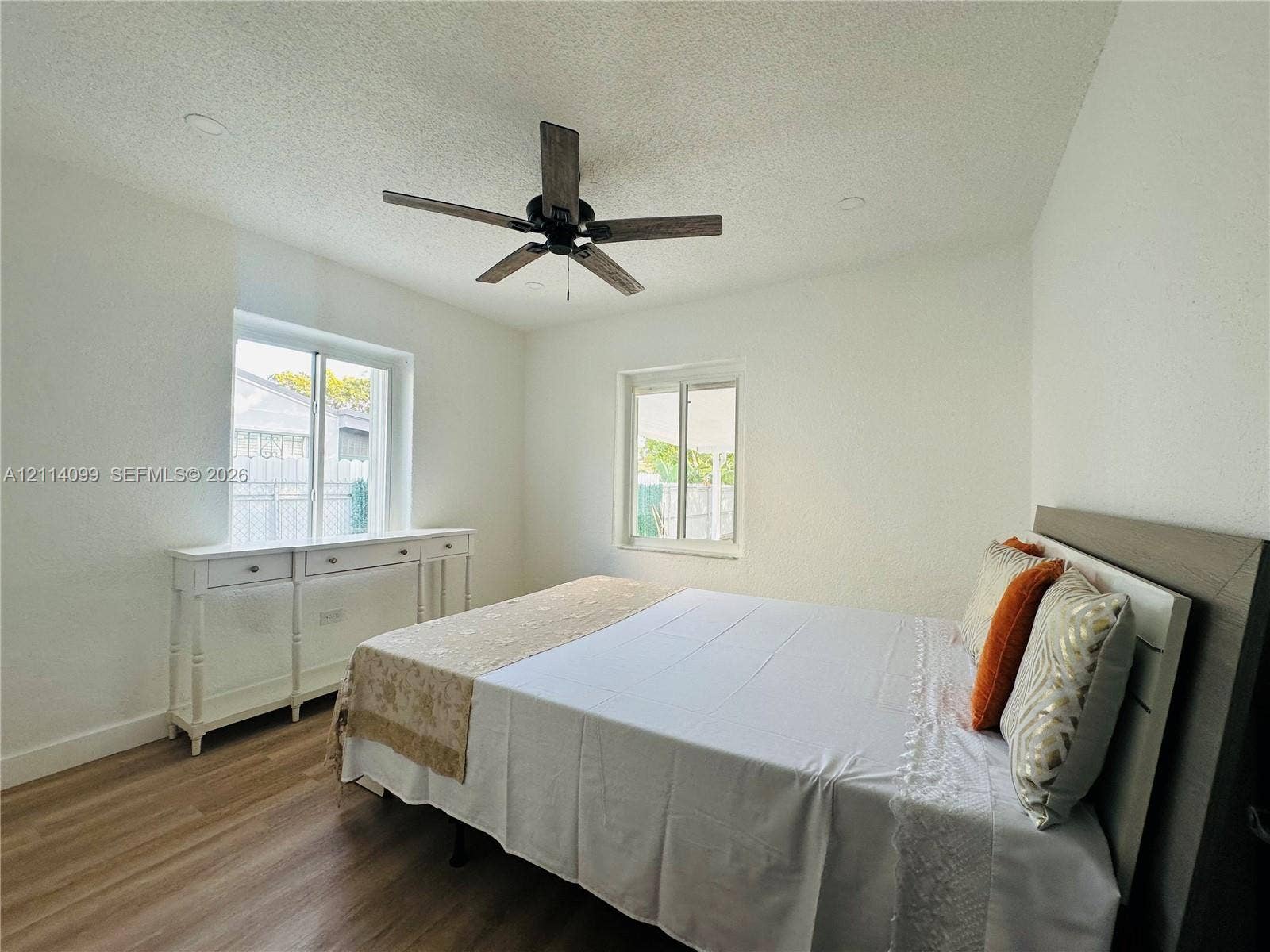 3052 SW 6th Street, Miami, FL 33135 Wood-finish flooring, recessed lighting, multi-blade ceiling fan, and dual single-hung windows