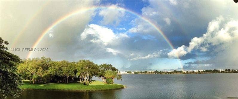 2485 NW 33rd Street, #1602, Oakland Park, Oakland Park, FL 33309 Expansive body of water bordered by a shoreline featuring mature trees and established greenery