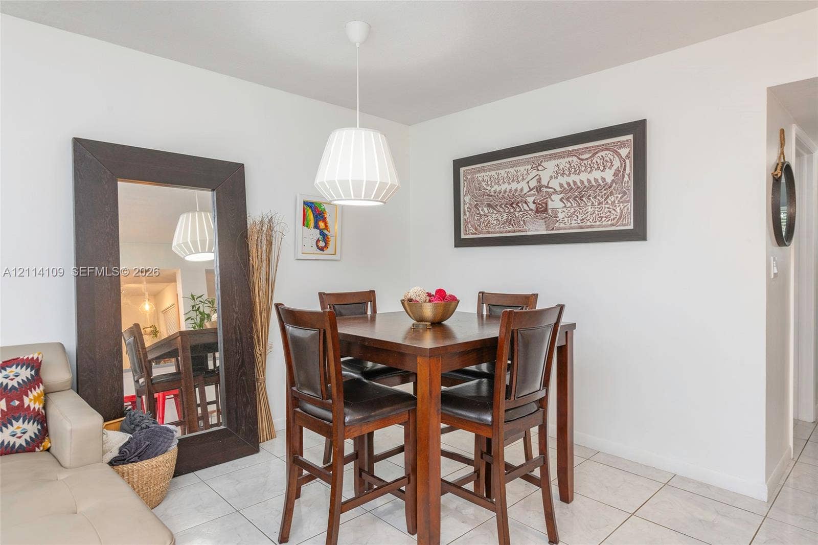 15761 SW 137th Avenue, #104, Miami, Miami, FL 33177 Neutral-toned tile flooring, white wall finishes, and a contemporary pendant light fixture