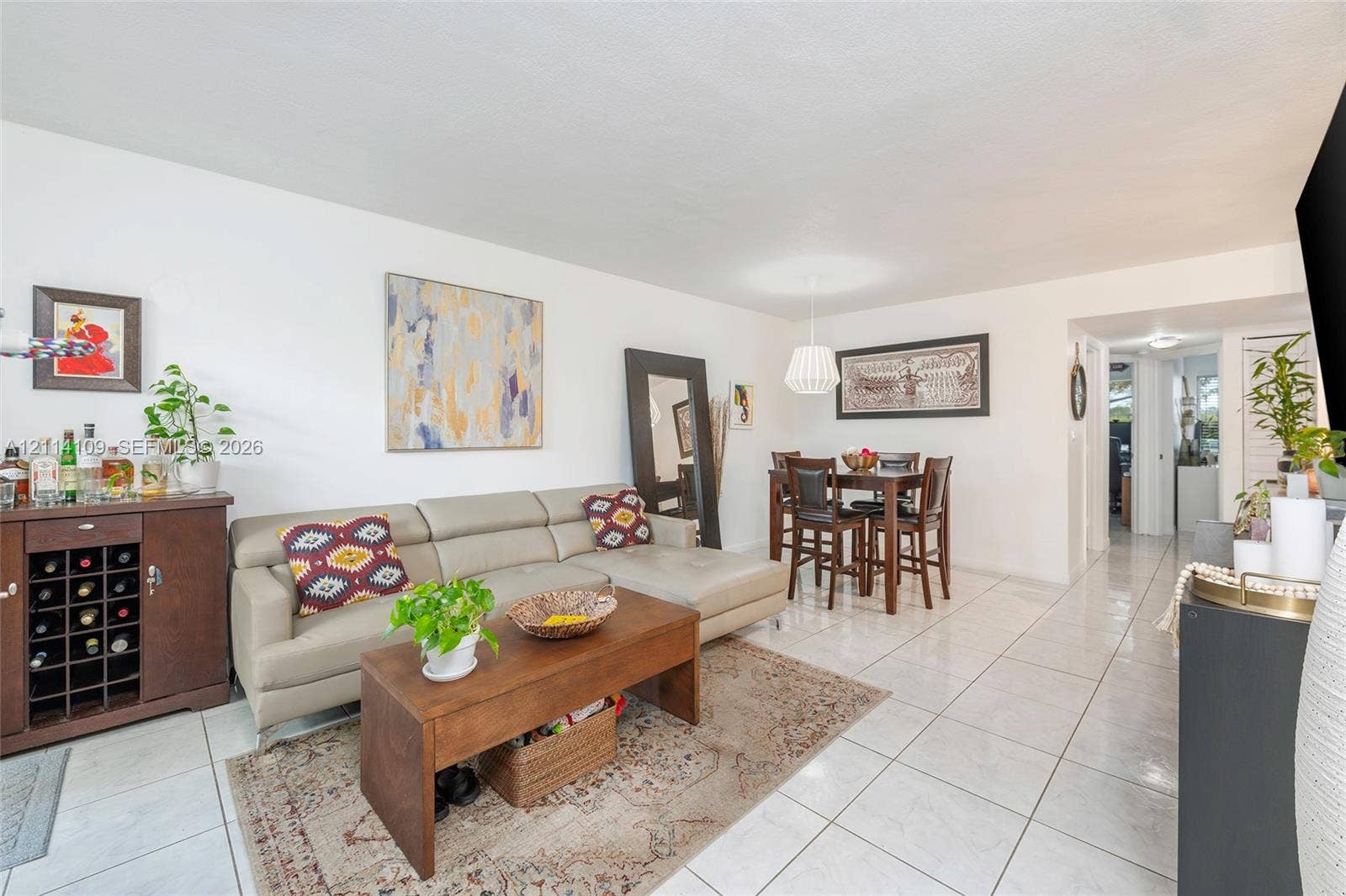 15761 SW 137th Avenue, #104, Miami, Miami, FL 33177 Neutral-toned tile flooring, white wall finishes, and a contemporary drum-style pendant light fixture