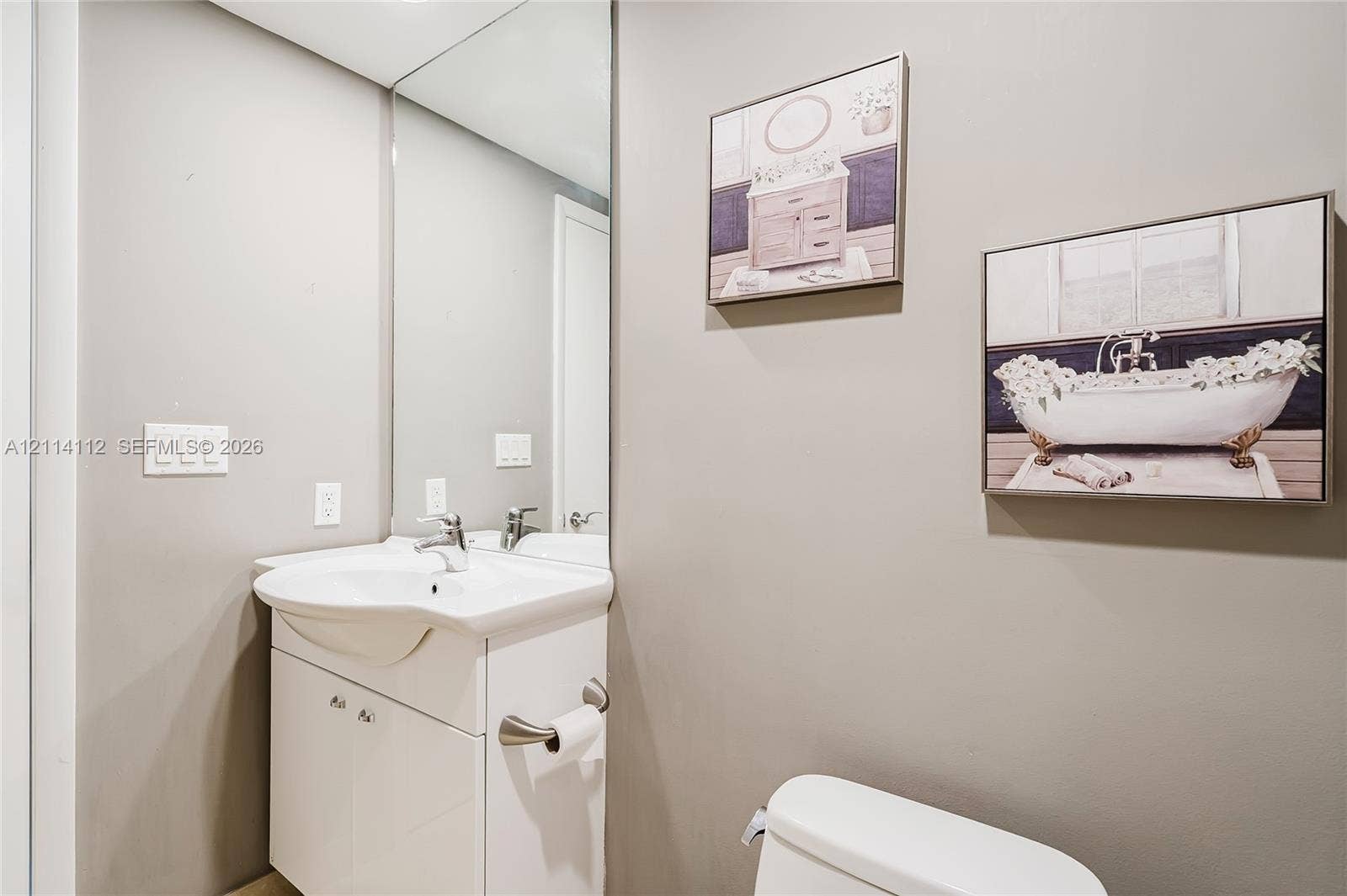1850 S Ocean Drive, #4008, Hallandale Beach, FL 33009 White vanity with an integrated basin, high-gloss countertop, and wall-to-wall mirror