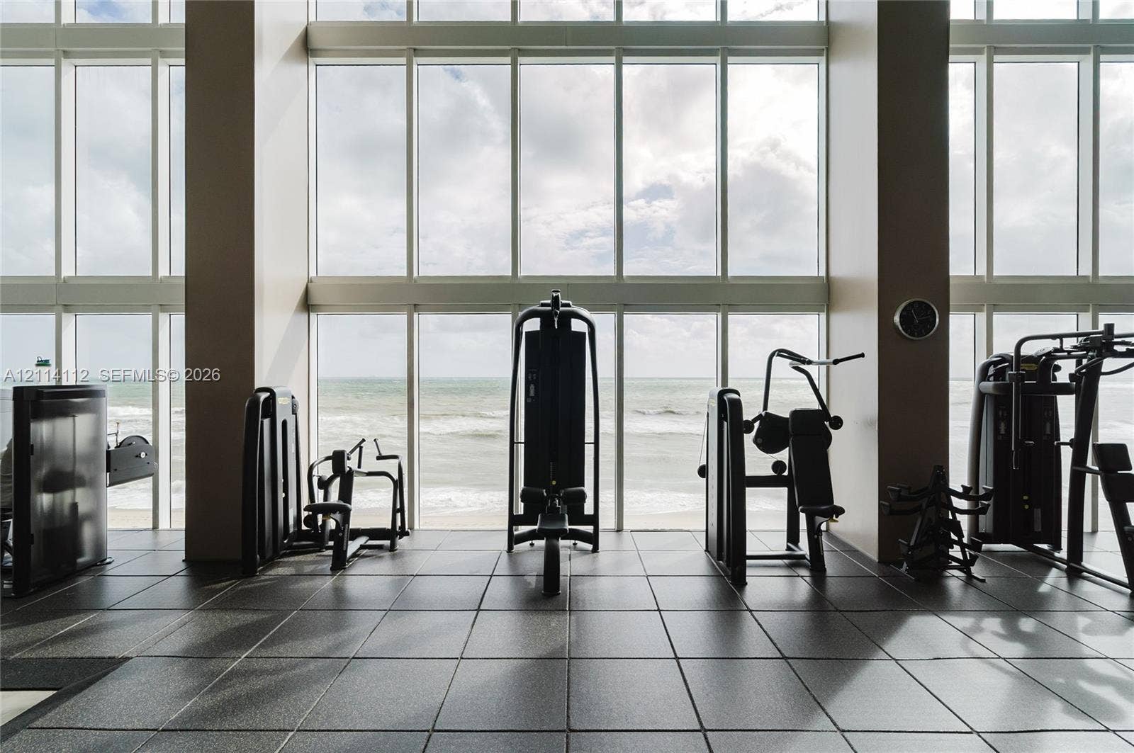 1850 S Ocean Drive, #4008, Hallandale Beach, FL 33009 Floor-to-ceiling windows featuring ocean scenery, square tile flooring, and expansive structural columns