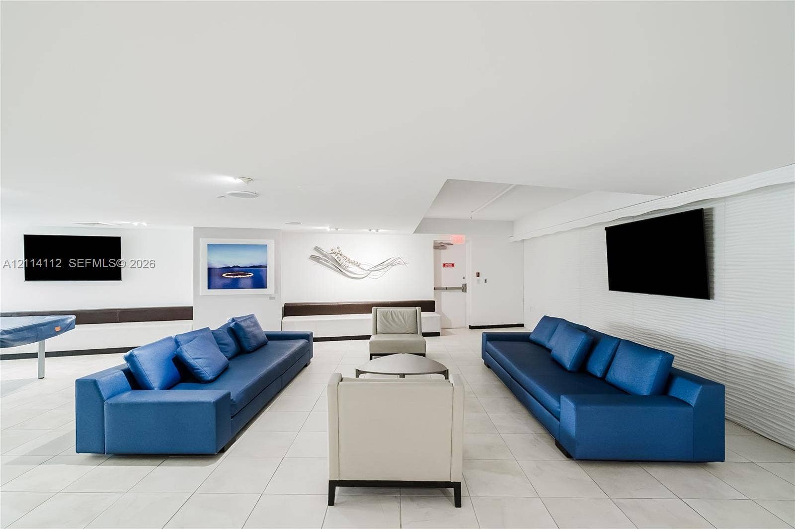 1850 S Ocean Drive, #4008, Hallandale Beach, FL 33009 Interior space featuring large-format tile flooring, recessed ceiling lighting, and horizontal textured wall paneling