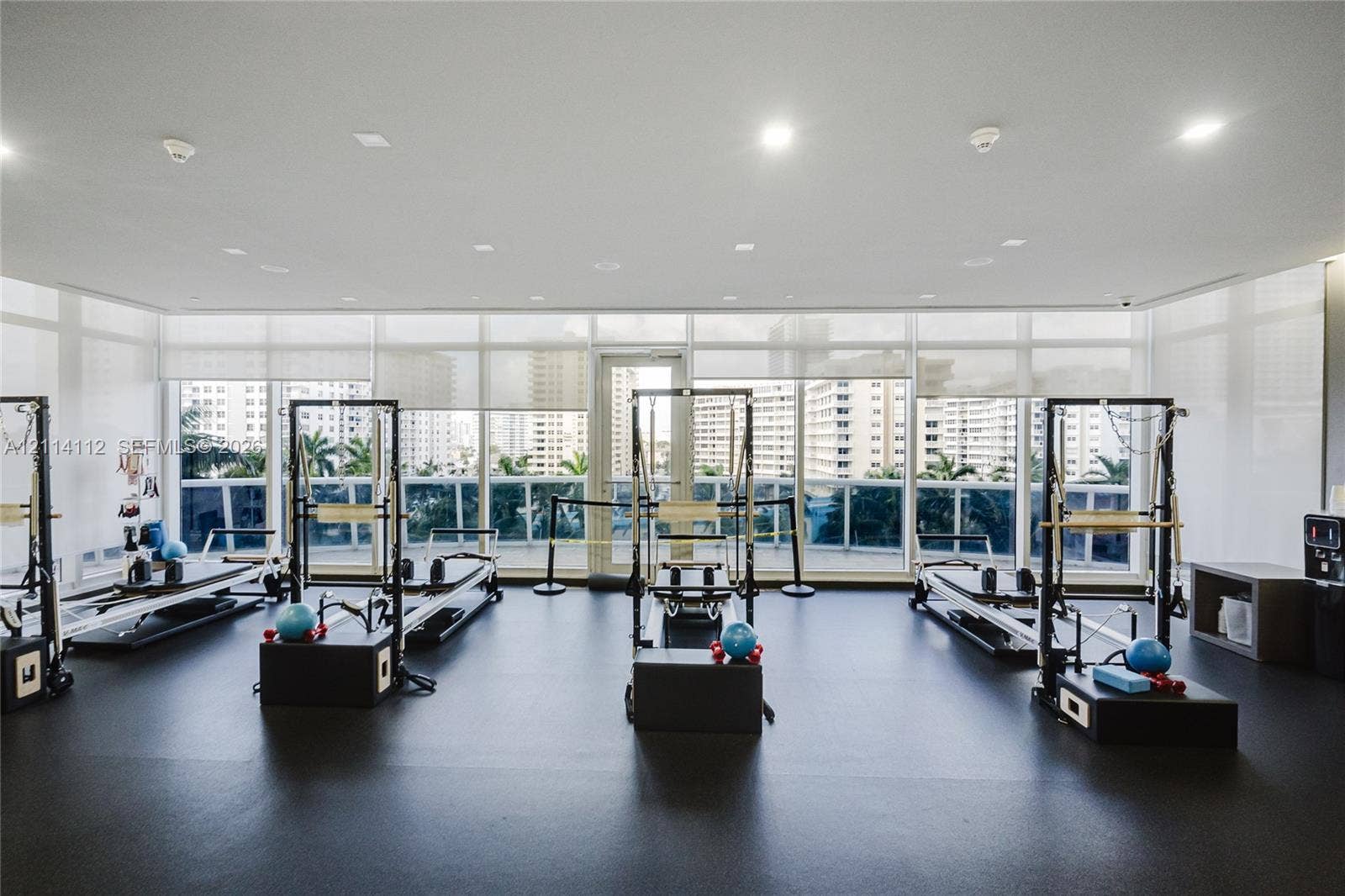 1850 S Ocean Drive, #4008, Hallandale Beach, FL 33009 Fitness studio featuring floor-to-ceiling windows, recessed lighting, and resilient composite flooring