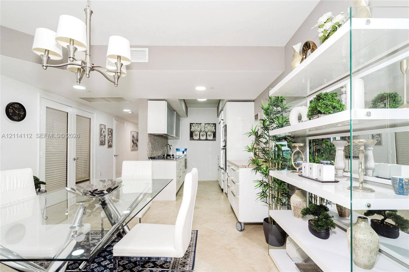 1850 S Ocean Drive, #4008, Hallandale Beach, FL 33009 Open-concept space featuring large-format tile flooring, a multi-arm chandelier, built-in white cabinetry, and recessed lighting