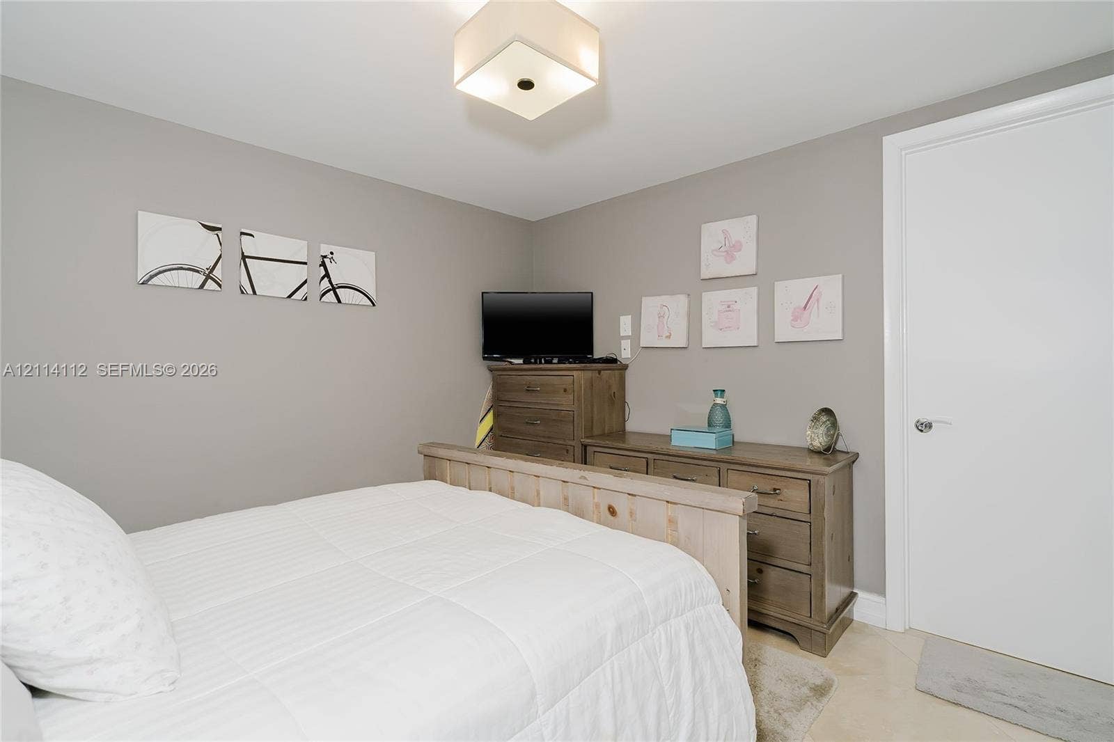 1850 S Ocean Drive, #4008, Hallandale Beach, FL 33009 Neutral-toned interior space featuring a flush-mount geometric light fixture and smooth wall finishes