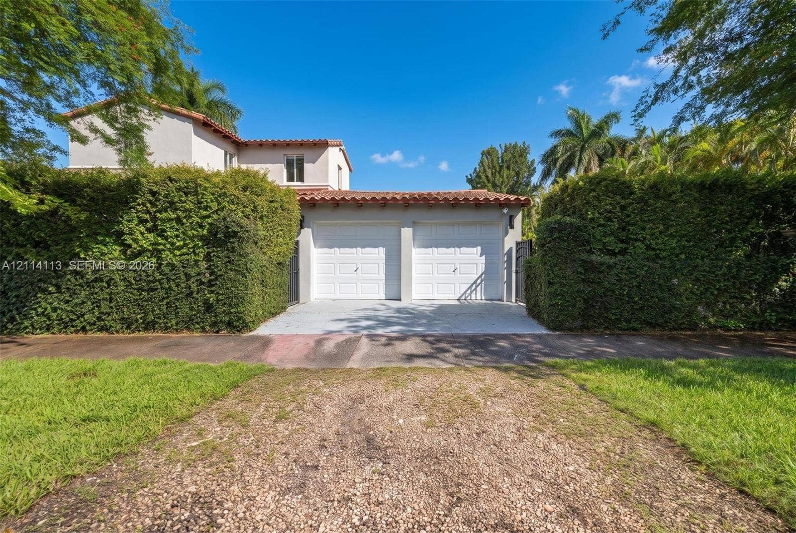 5386 Alton Road, Miami Beach, FL 33140 dual-bay garage and privacy hedges