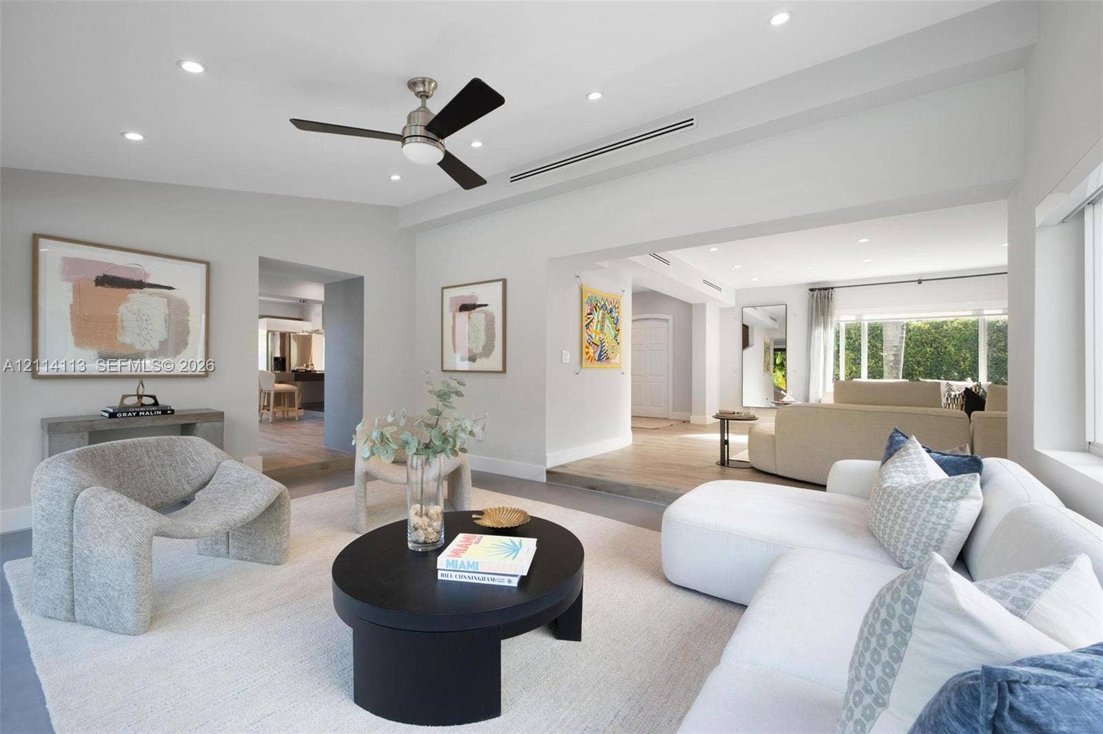 5386 Alton Road, Miami Beach, FL 33140 Neutral-toned interior featuring recessed lighting, a brushed-nickel ceiling fan, wood-finish flooring, and recessed linear HVAC diffusers