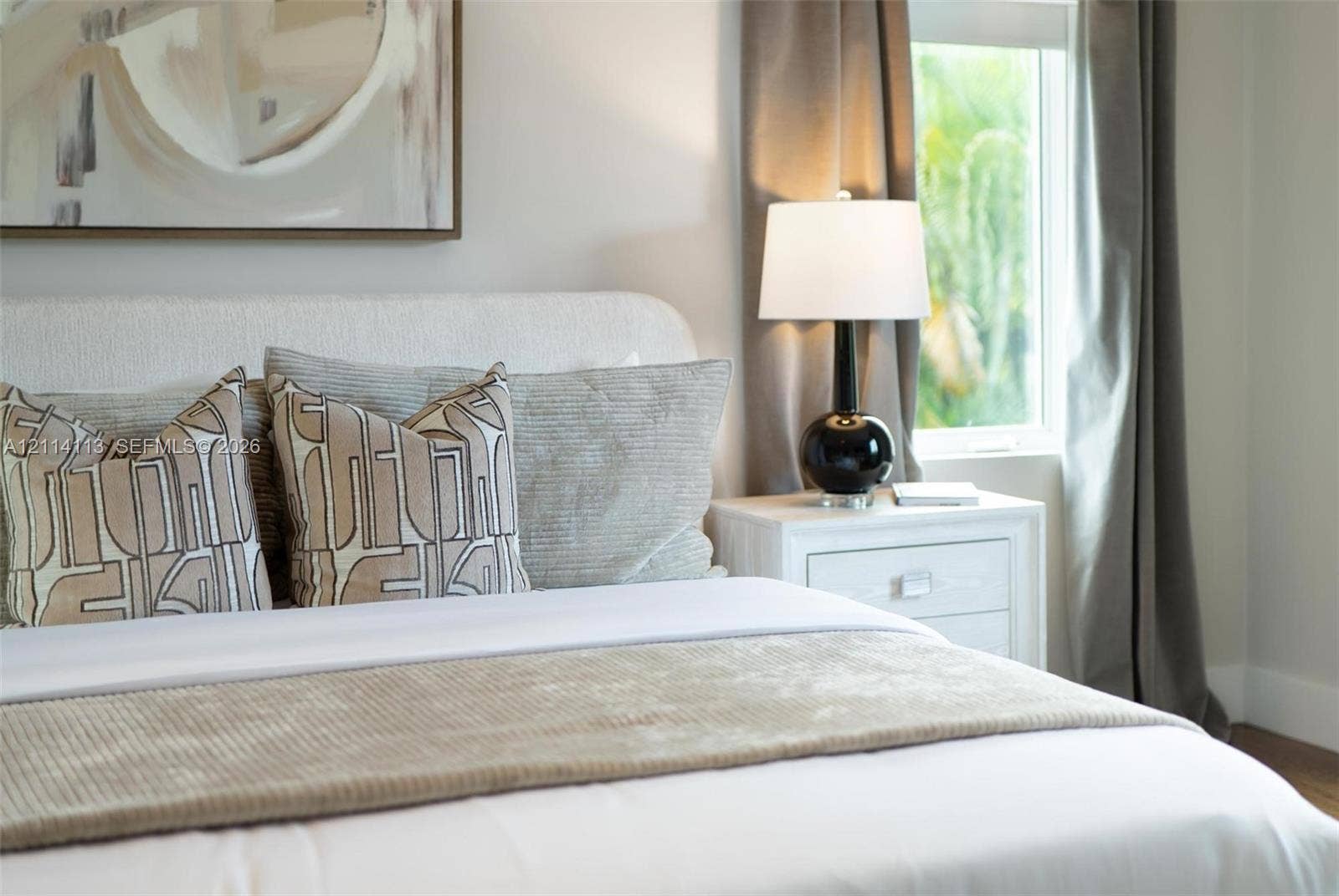 5386 Alton Road, Miami Beach, FL 33140 Neutral-toned walls and window featuring natural light