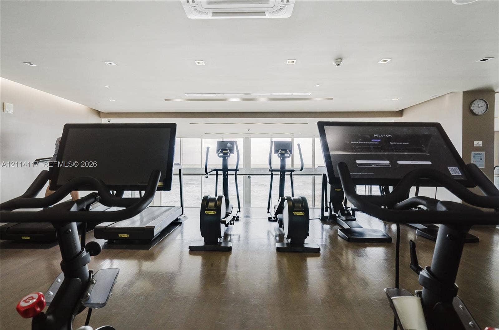 1850 S Ocean Drive, #4008, Hallandale Beach, Hallandale Beach, FL 33009 Fitness center featuring wood-finish flooring, recessed lighting, and large windows with integrated handrails