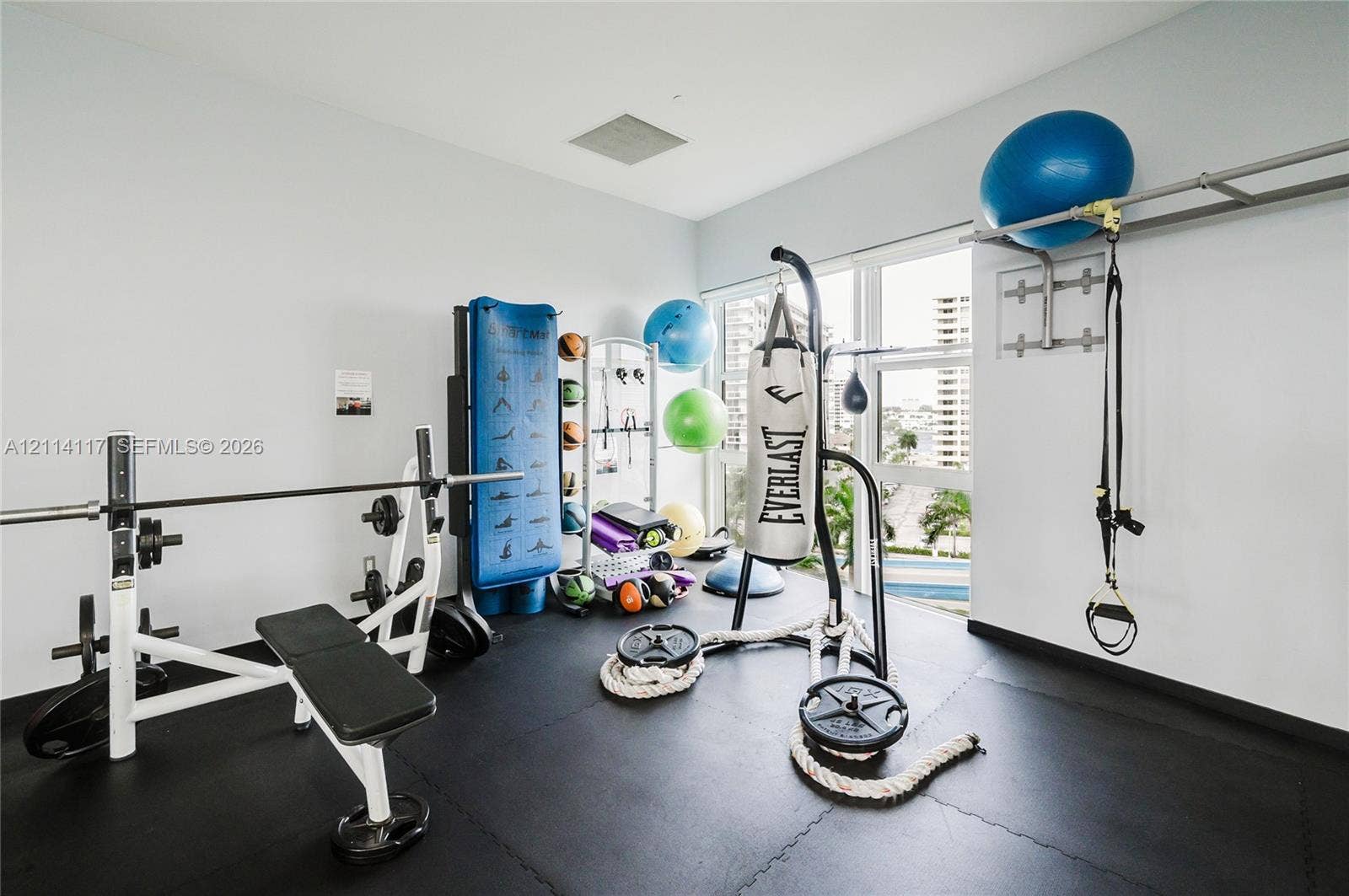 1850 S Ocean Drive, #4008, Hallandale Beach, Hallandale Beach, FL 33009 Fitness area featuring durable interlocking rubber flooring and floor-to-ceiling windows