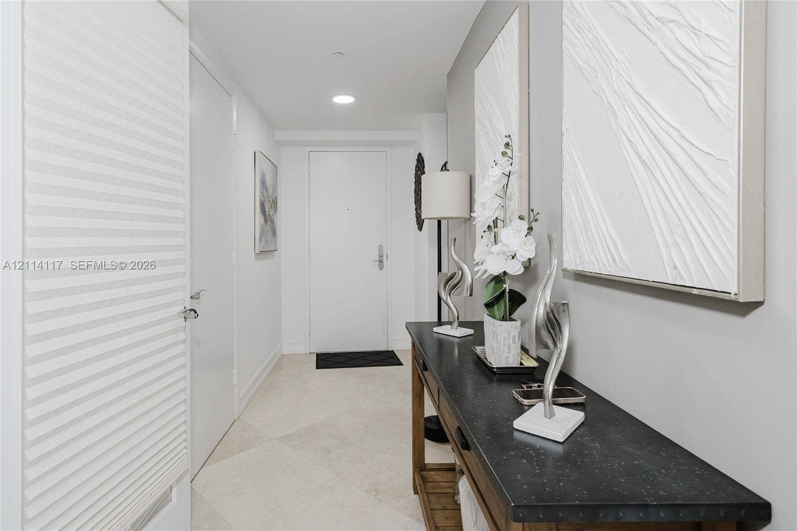1850 S Ocean Drive, #4008, Hallandale Beach, Hallandale Beach, FL 33009 Entryway featuring neutral-toned stone-finish tile flooring, recessed ceiling lighting, and solid-core interior doors