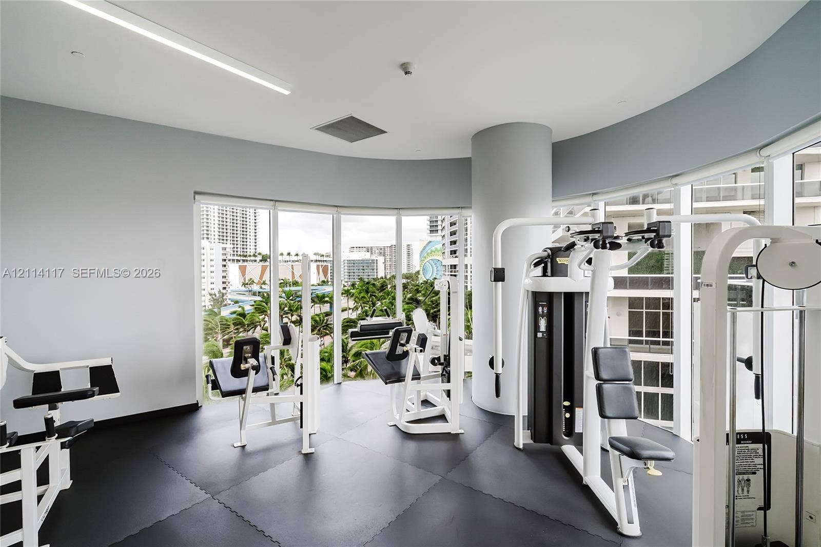 1850 S Ocean Drive, #4008, Hallandale Beach, Hallandale Beach, FL 33009 Fitness center featuring floor-to-ceiling windows, curved walls, and impact-resistant modular rubber flooring