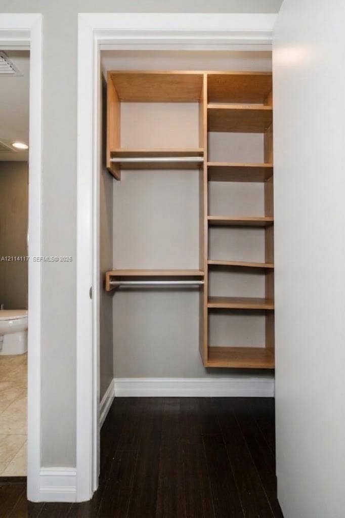 1850 S Ocean Drive, #4008, Hallandale Beach, Hallandale Beach, FL 33009 Built-in closet featuring light wood-finish shelving, multiple storage compartments, and integrated hanging rods
