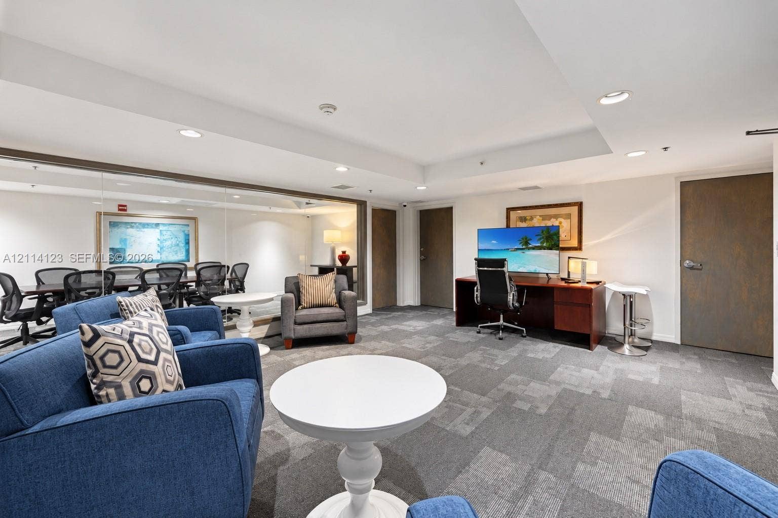 1155 Brickell Bay Drive, #2609, Miami, FL 33131 Open-concept room featuring wall-to-wall mirrors, recessed lighting, and patterned carpet flooring