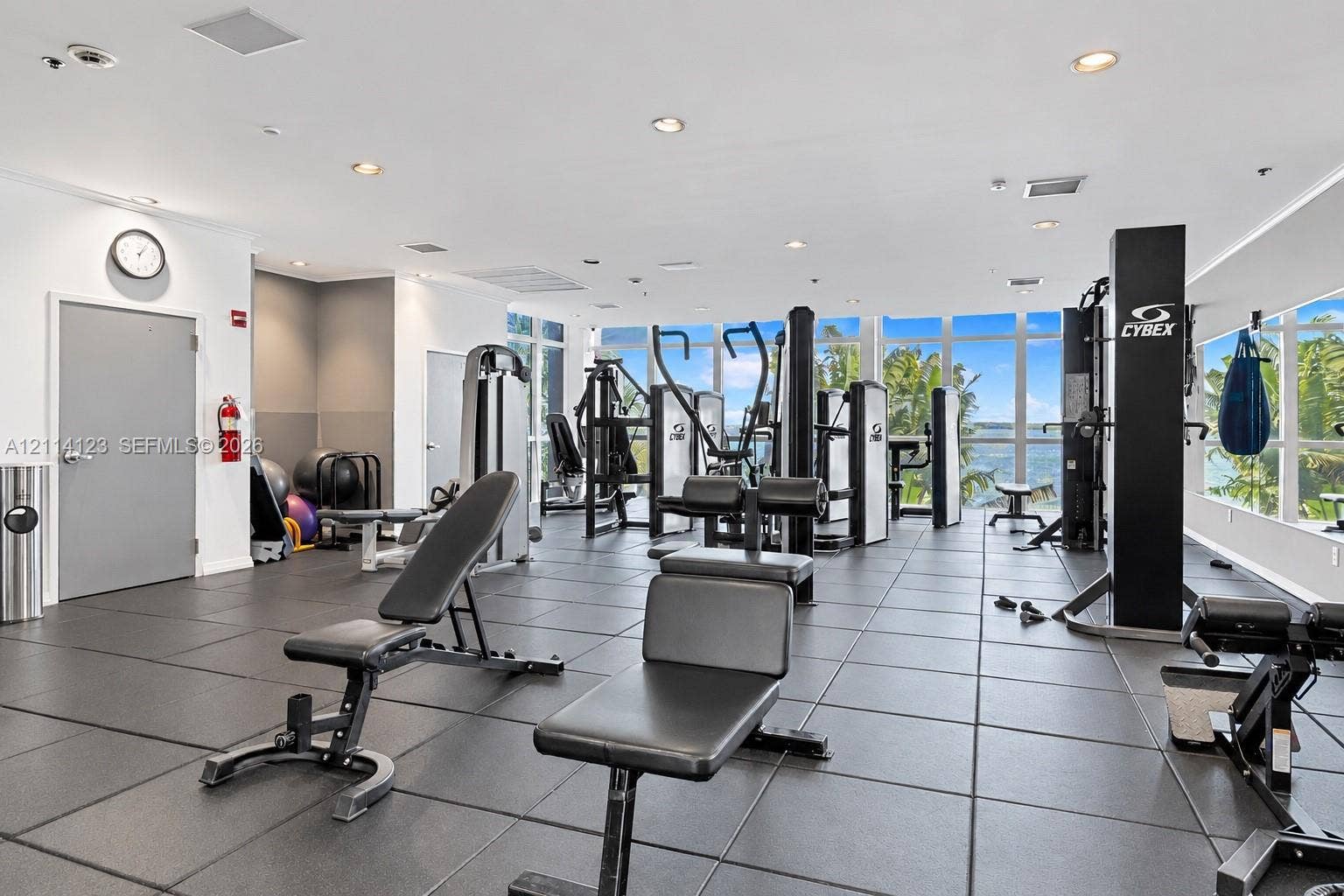 1155 Brickell Bay Drive, #2609, Miami, FL 33131 Fitness center featuring floor-to-ceiling windows, rubberized flooring, and recessed ceiling lighting