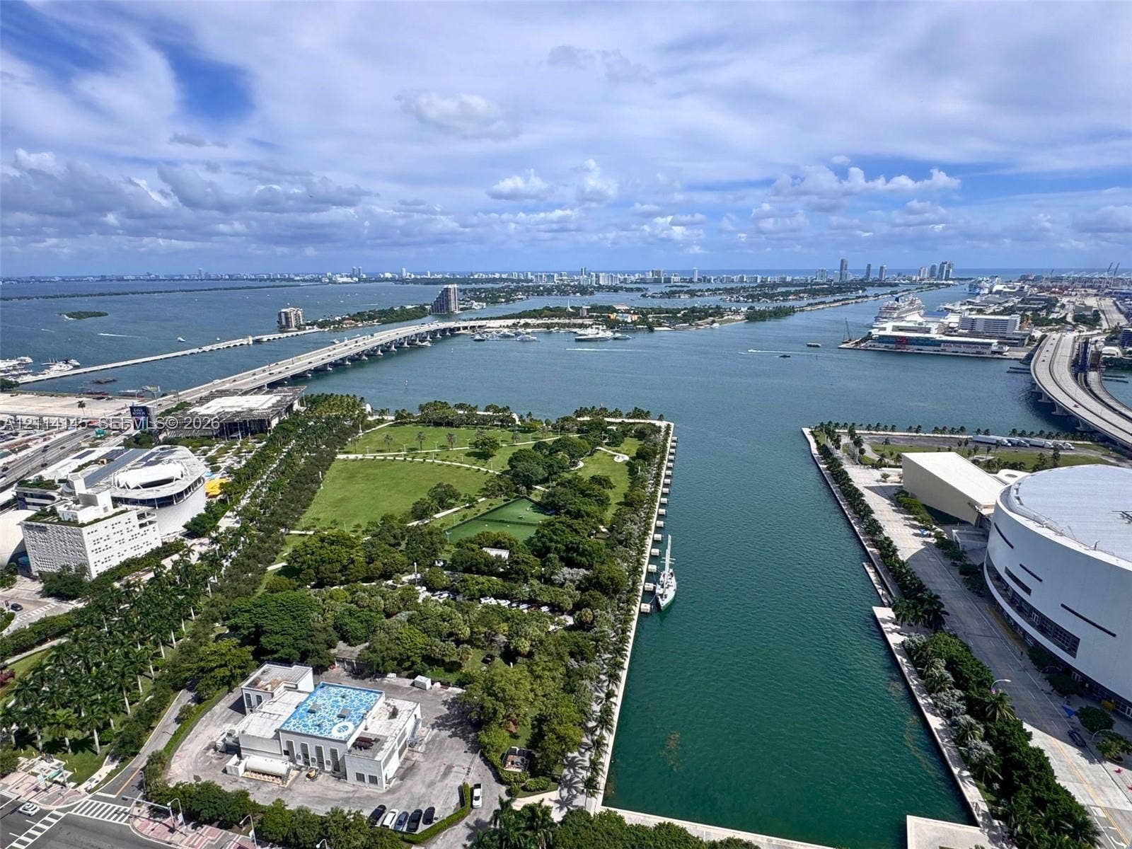 Aerial perspective showcasing expansive water frontage, direct exposure to the bay, and proximity to green space