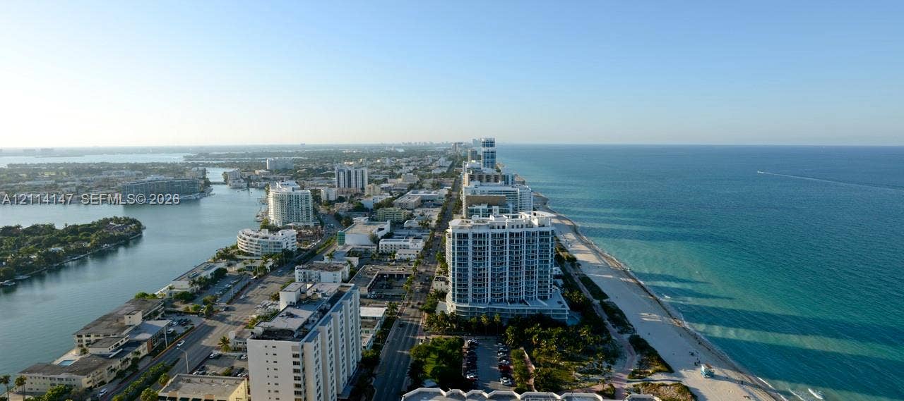6365 Collins Avenue, #3908, Miami Beach, FL 33141 Aerial perspective featuring coastal shoreline, oceanfront geography, urban skyline, and inlet waterways