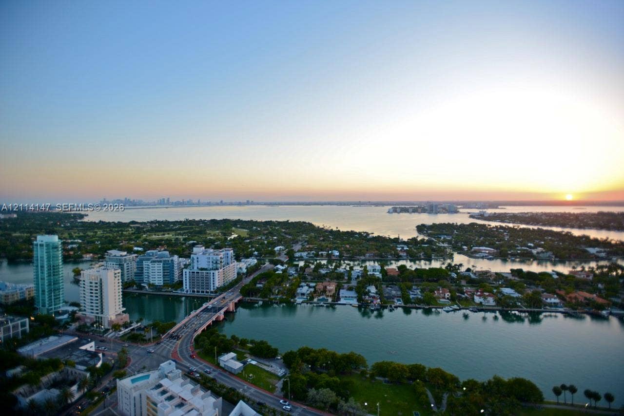 6365 Collins Avenue, #3908, Miami Beach, FL 33141 Aerial perspective overlooking coastal waterways, a bridge, metropolitan high-rises, and extensive harbor scenery