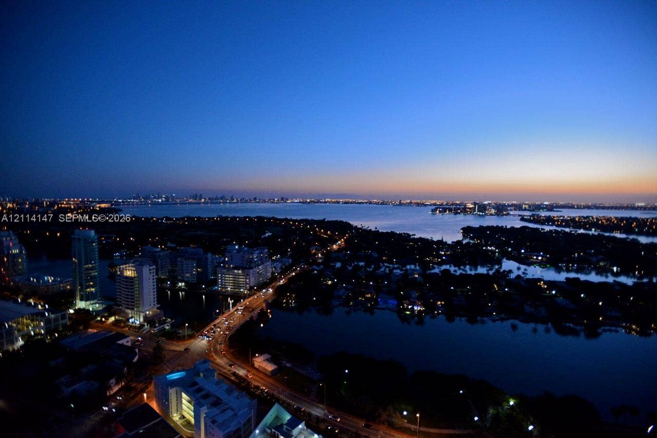 6365 Collins Avenue, #3908, Miami Beach, FL 33141 Elevated perspective featuring coastal waters, urban skyline, and bridge infrastructure