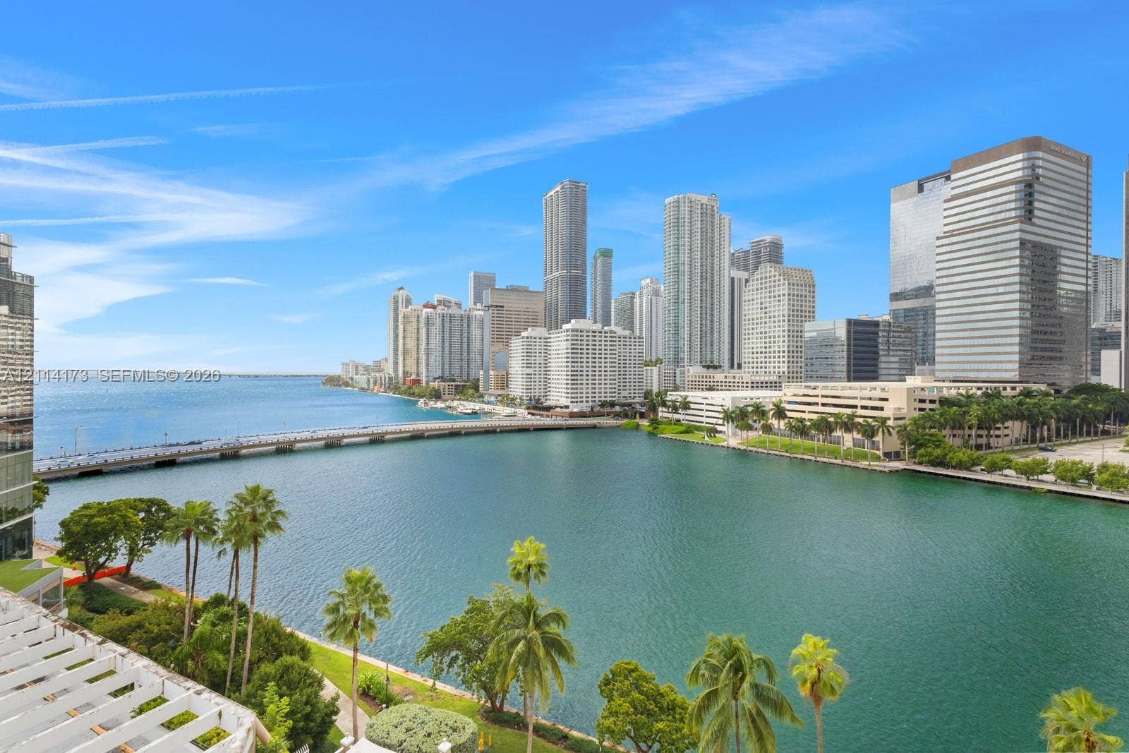 701 Brickell Key Boulevard, #1012, Miami, FL 33131 Panoramic waterfront outlook featuring the downtown skyline, a concrete bridge, and established palm trees