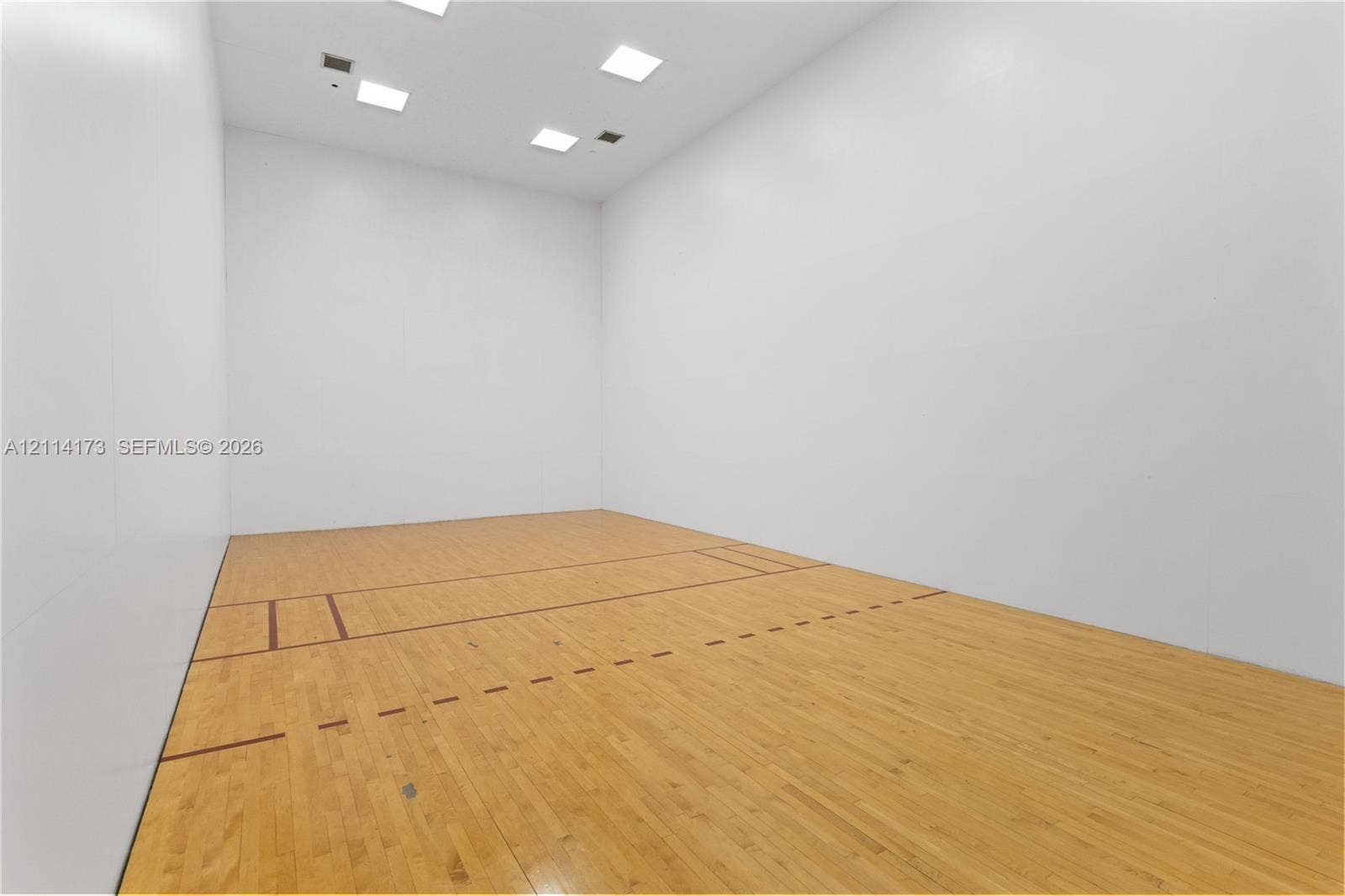 701 Brickell Key Boulevard, #1012, Miami, FL 33131 Recreational court featuring smooth panel walls, wood-finish flooring with court markings, and recessed ceiling lighting
