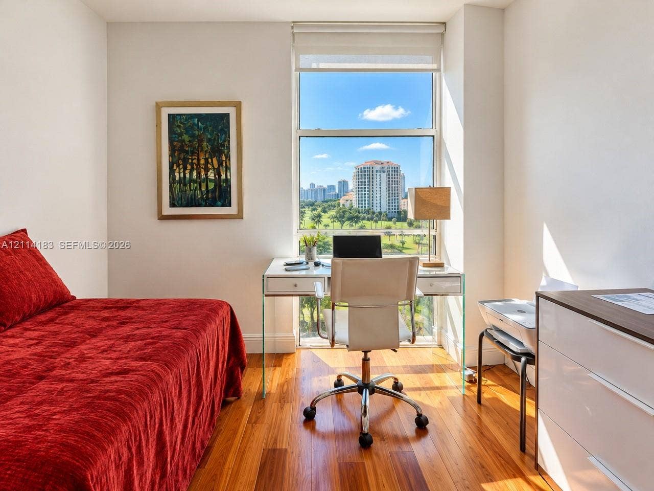 20379 W Country Club Drive, #938, Aventura, FL 33180 Wood-finish flooring and a tall, multi-pane window featuring an urban and landscape panorama