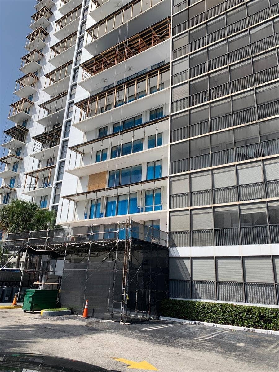 3701 N Country Club Drive, #706, Aventura, FL 33180 Multi-story residential high-rise featuring concrete facade construction, extensive private balcony space, and window systems