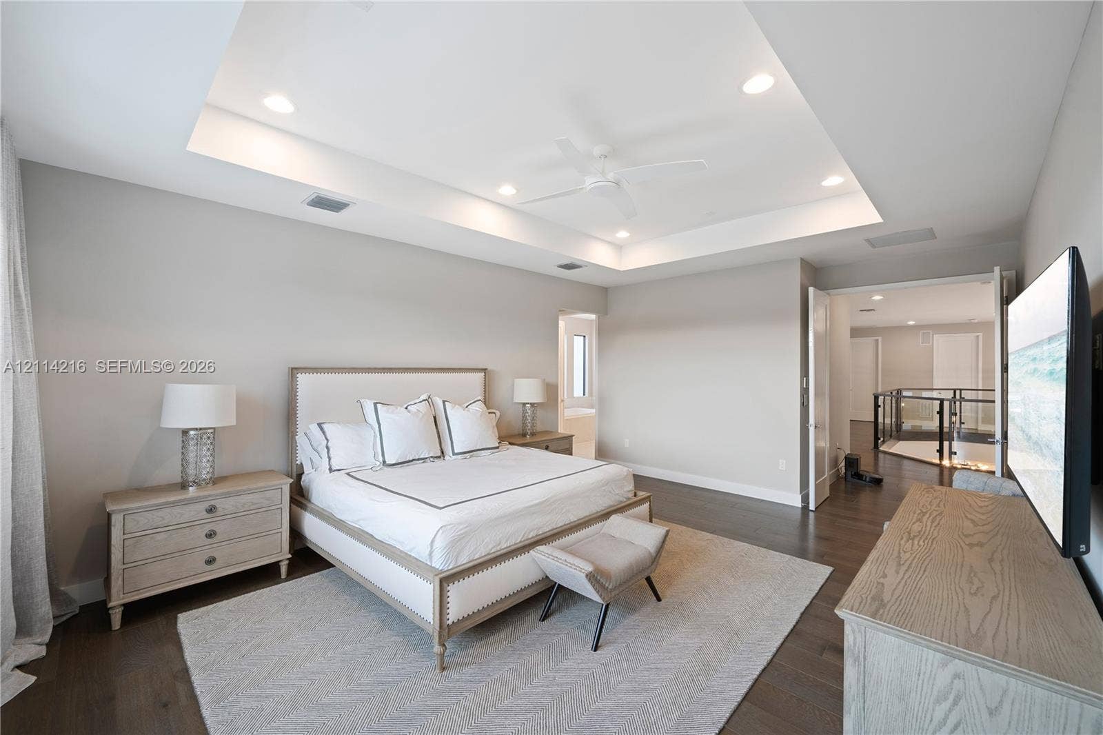 17085 Teton River Road, Boca Raton, FL 33496 Tray ceiling with recessed lighting, central ceiling fan, and dark wood-finish flooring