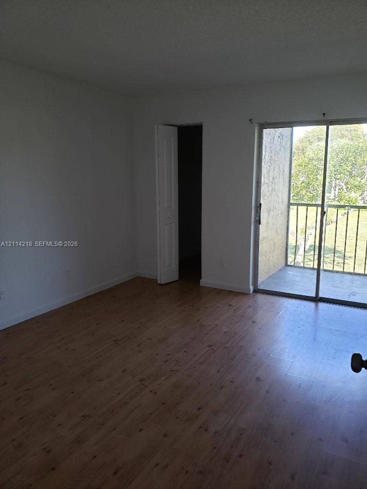 1116 Meadows Circle, #1116, Boynton Beach, Boynton Beach, FL 33436 Wood-finish flooring, sliding glass door, and private exterior balcony