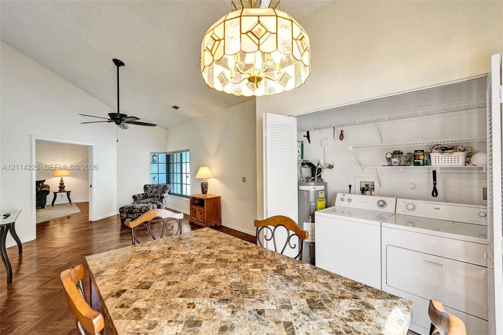 5741 SW 88th Terrace, Cooper City, FL 33328 Vaulted ceilings, wood-finish herringbone flooring, and custom-designed stained glass multi-tier pendant lighting