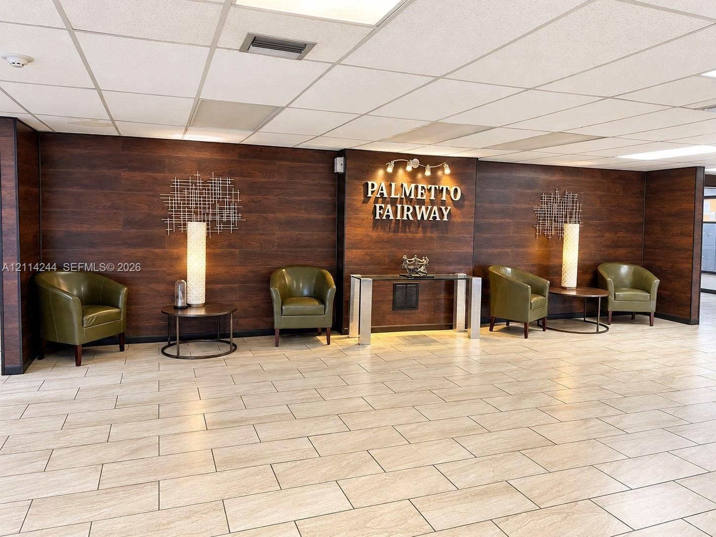 15888 SW 95th Avenue, #307, Miami, Miami, FL 33157 Lobby featuring dark wood-finish wall paneling and tile flooring.