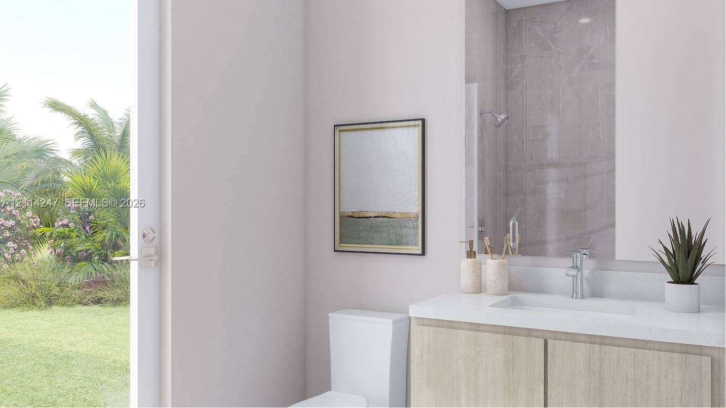 This en-suite bathroom also enjoys direct access to the backyard.