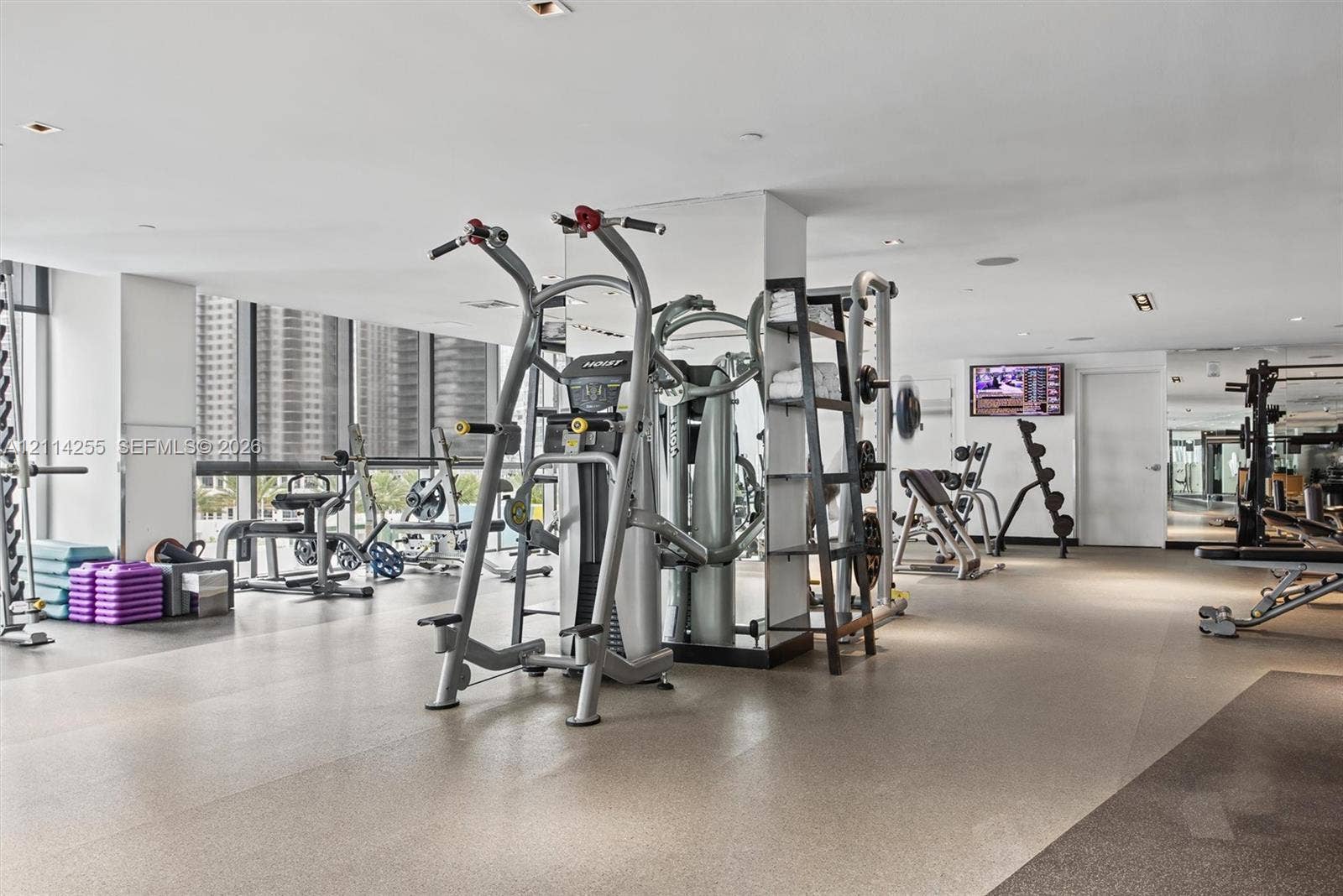 900 Biscayne Boulevard, #1705, Miami, FL 33132 Fitness center featuring floor-to-ceiling windows, recessed lighting, and industrial-grade rubberized flooring