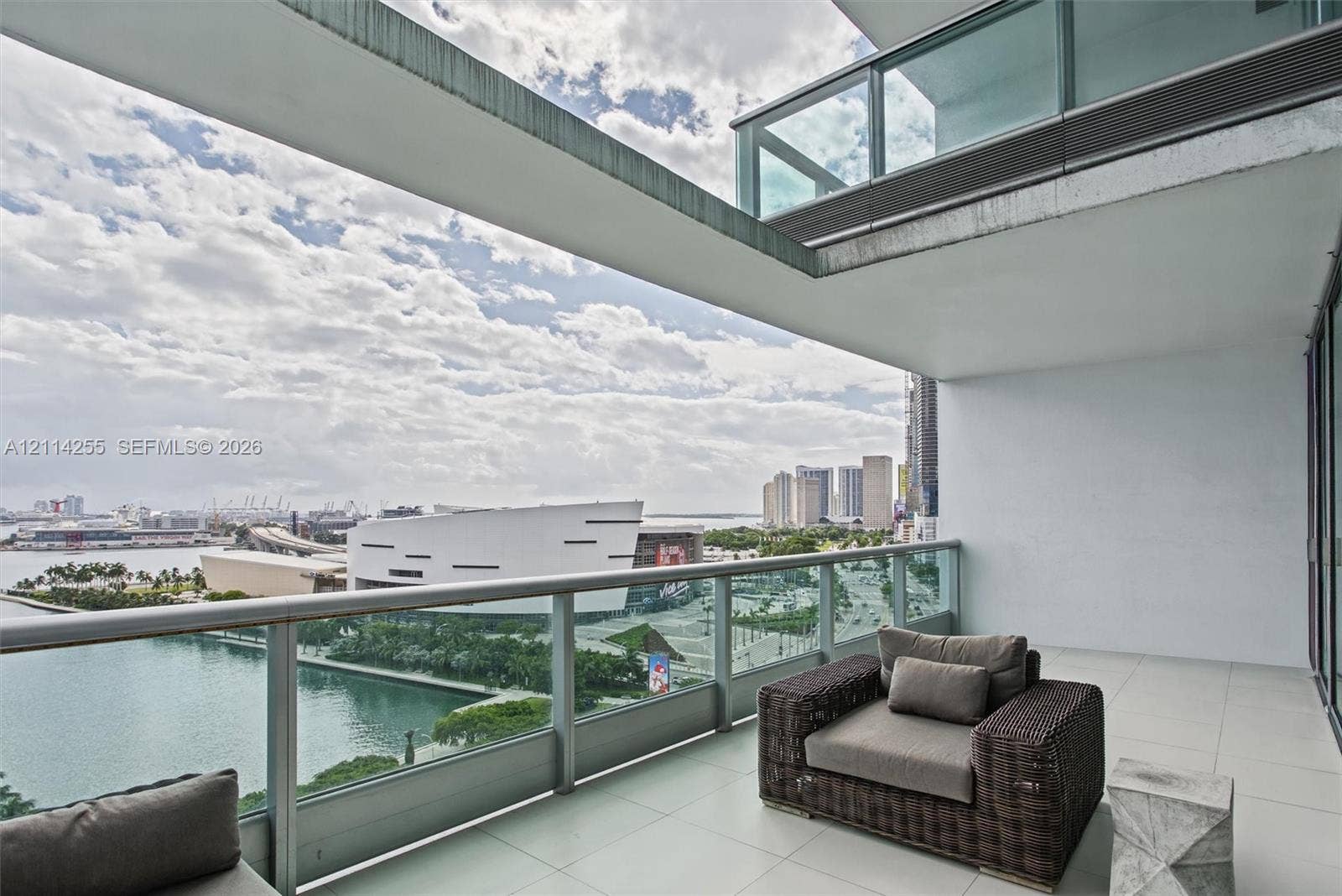 900 Biscayne Boulevard, #1705, Miami, FL 33132 Covered outdoor terrace featuring large-format tile flooring and a glass-panel railing