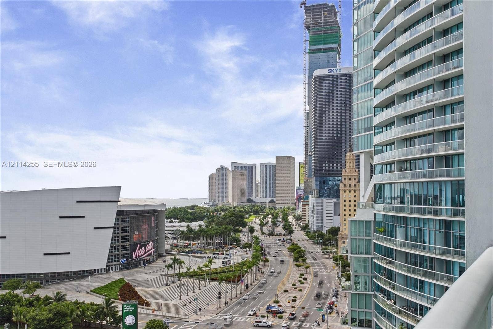 900 Biscayne Boulevard, #1705, Miami, FL 33132 Private balcony with glass panel railing overlooking urban skyline and waterfront architecture