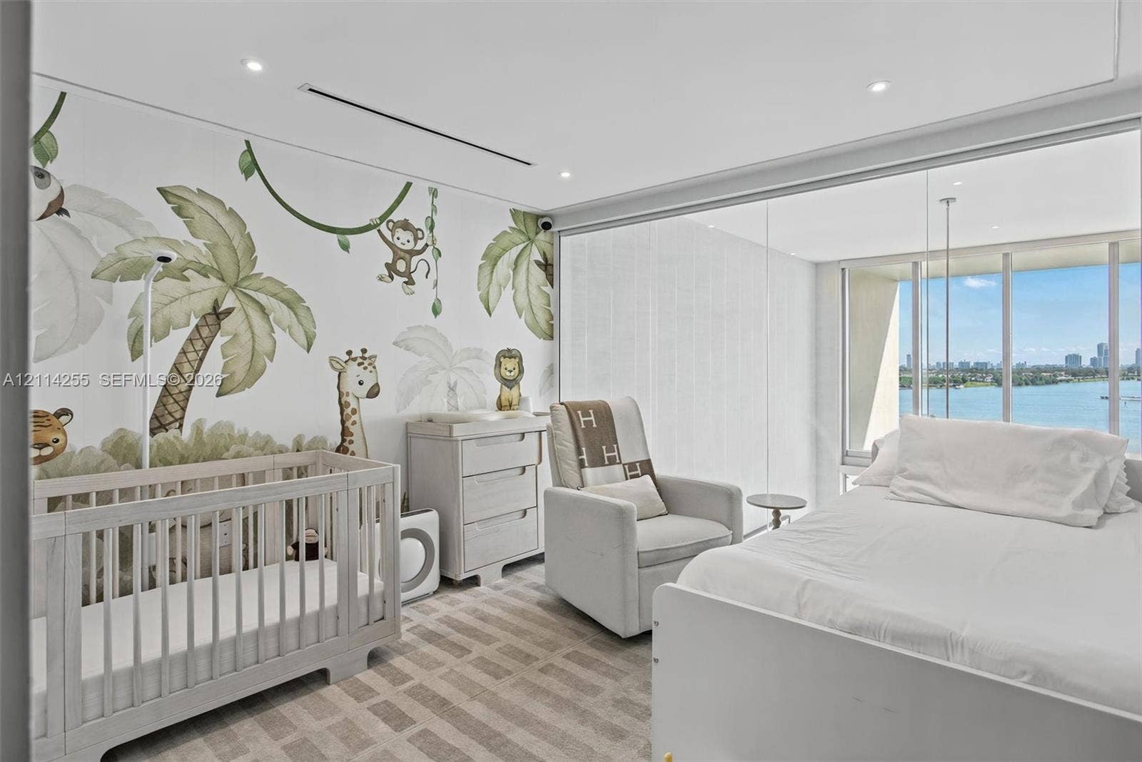 900 Biscayne Boulevard, #1705, Miami, FL 33132 Floor-to-ceiling windows with water backdrop, recessed lighting, and wall-to-wall carpeting