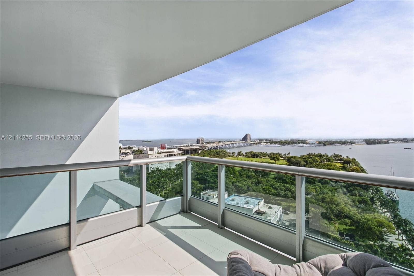 900 Biscayne Boulevard, #1705, Miami, FL 33132 Covered balcony featuring tile flooring and a glass-paneled metal railing