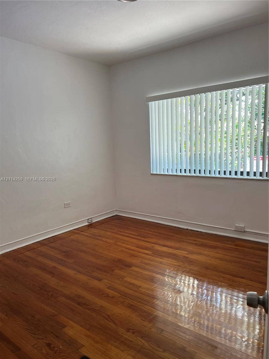 1895 SW 22nd, #5, Miami, Miami, FL 33145 Room featuring wood-finish flooring and a horizontal window with vertical blinds