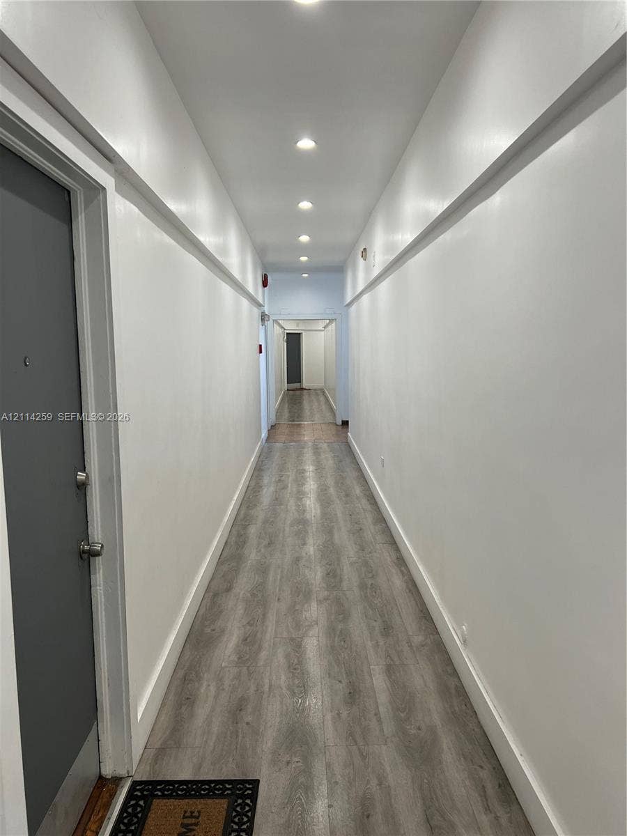 1895 SW 22nd, #5, Miami, Miami, FL 33145 Hallway featuring wood-finish flooring, recessed lighting, and crisp white wall molding