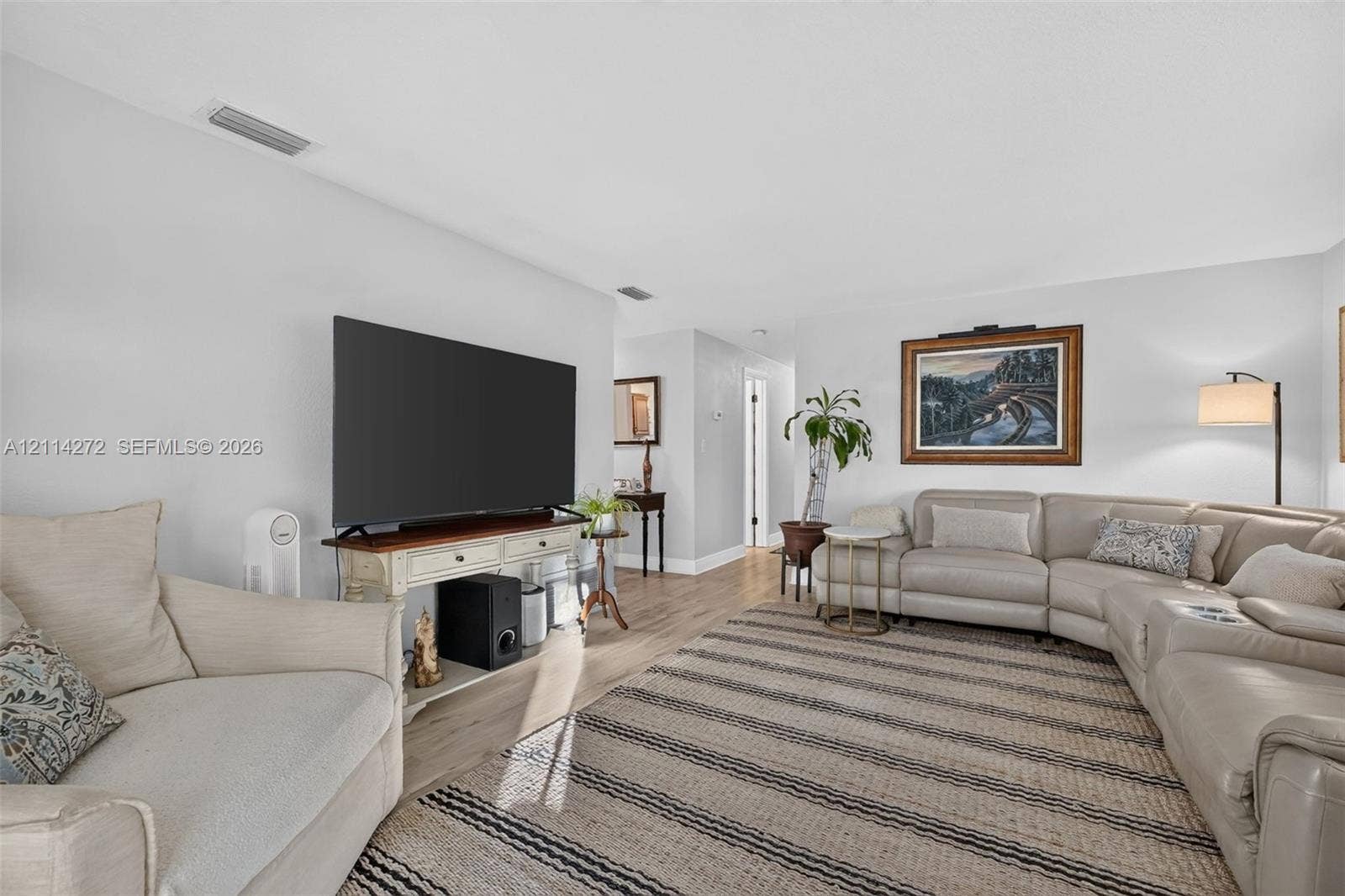 110 Cunningham, New Smyrna Beach, FL 32168 Neutral-toned interior featuring wood-finish flooring and smooth-textured walls