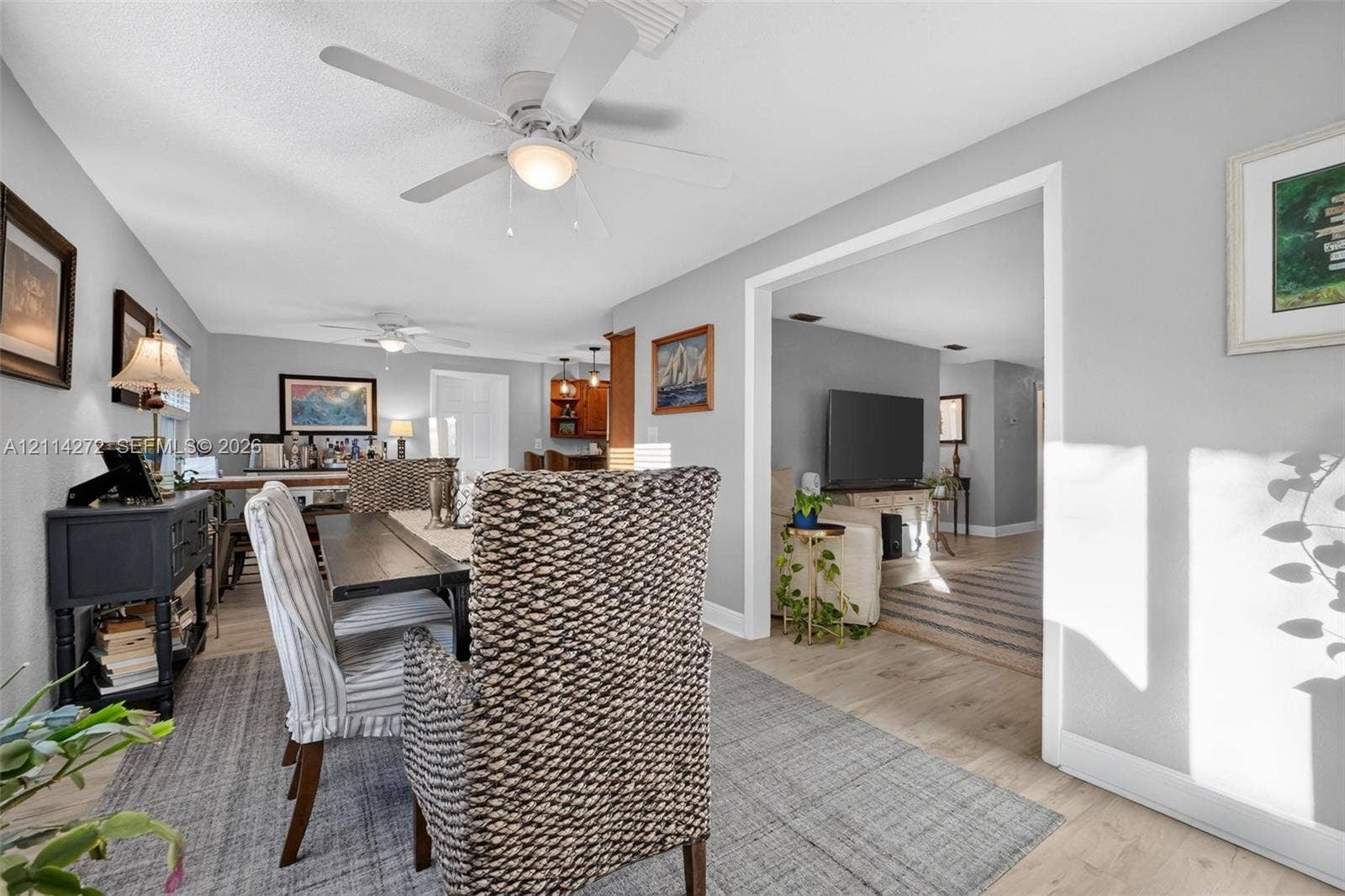 110 Cunningham, New Smyrna Beach, FL 32168 Neutral wall palette with wood-finish flooring and multiple ceiling fans