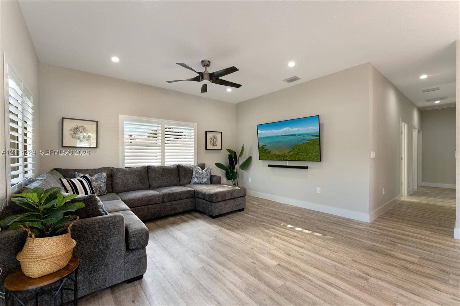 646 Cabrera Street, Key Largo, FL 33037 Living area featuring wood-finish flooring, recessed lighting, a ceiling fan, and plantation shutters
