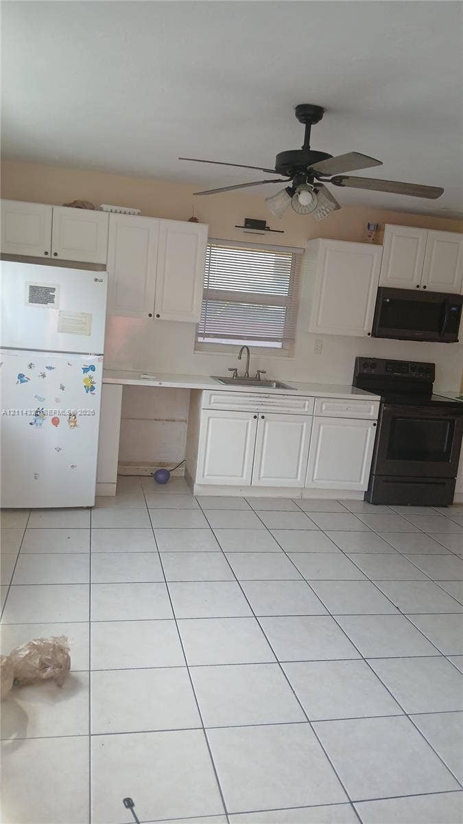 2131 N 19th Avenue, #2133, Hollywood, Hollywood, FL 33020 Kitchen featuring white shaker-style cabinetry, tile flooring, a dual-basin sink, and a ceiling fan