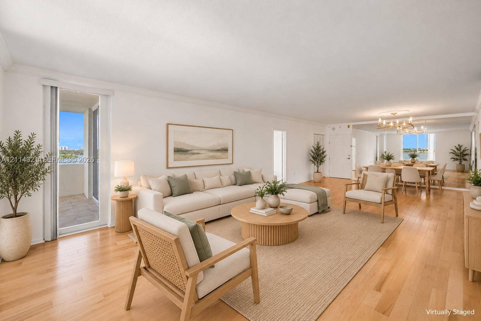 10350 W Bay Harbor Drive, #9C, Bay Harbor Islands, FL 33154 Open-concept living space featuring wood-finish flooring, recessed lighting, floor-to-ceiling mirrored wall paneling, and sliding glass door access to a private balcony