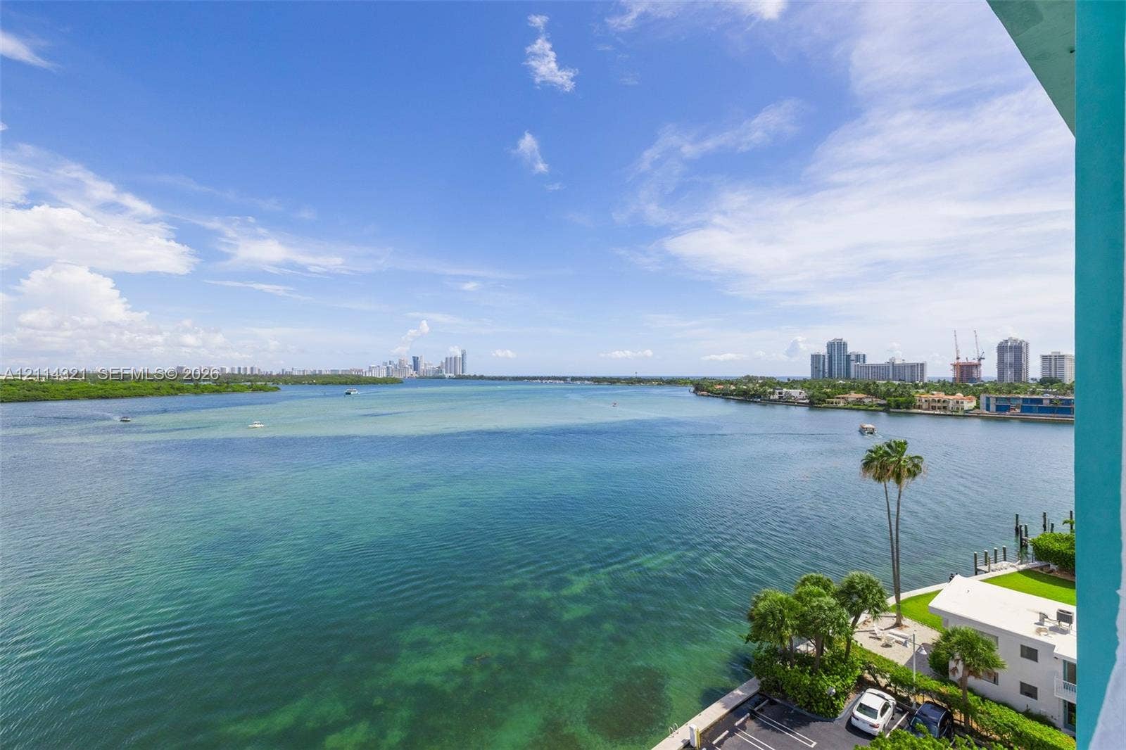 10350 W Bay Harbor Drive, #9C, Bay Harbor Islands, FL 33154 Elevated balcony featuring an expansive water panorama and coastal skyline