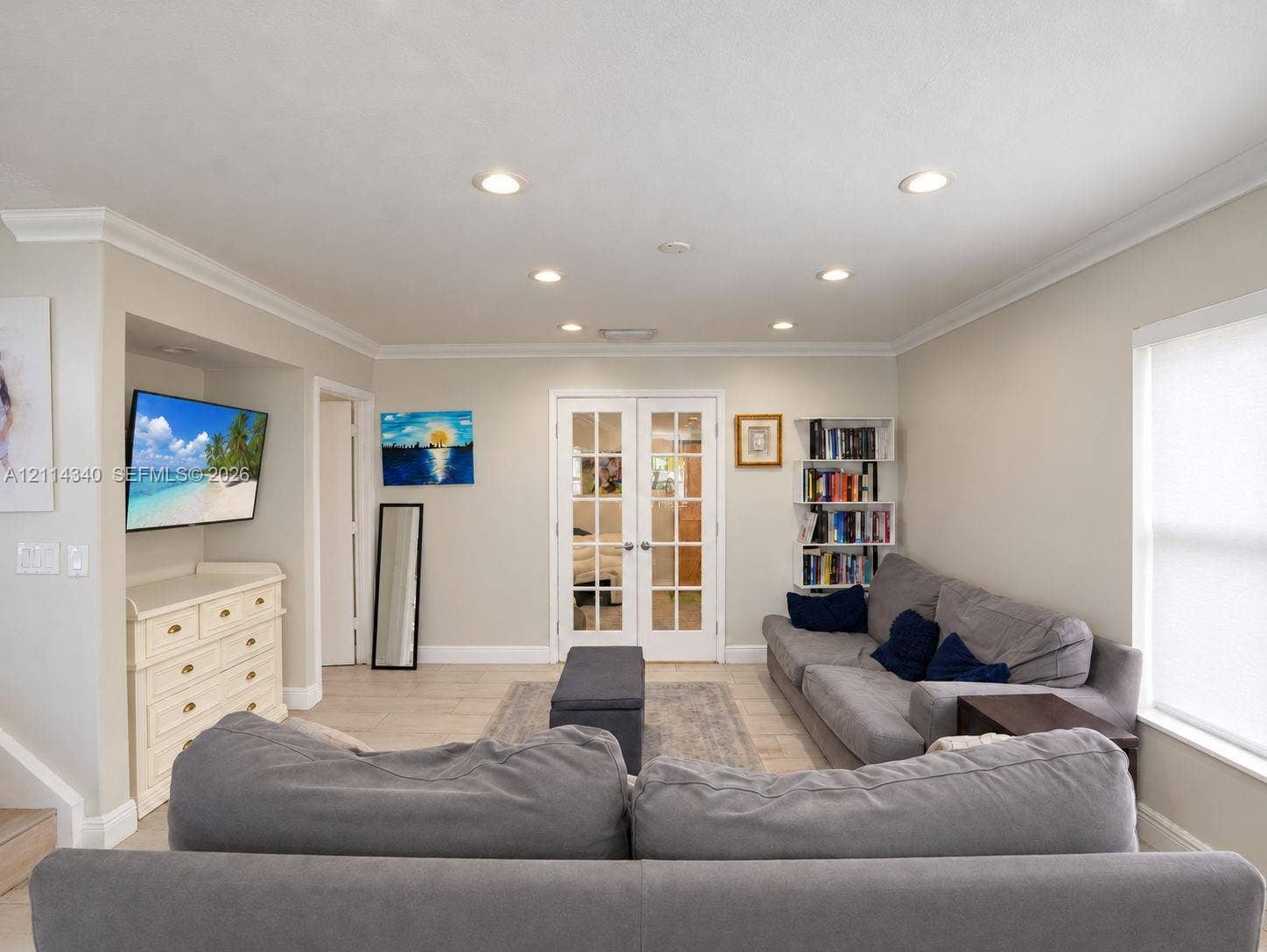 3586 SW 50th Street, Hollywood, FL 33312 Interior space featuring recessed lighting, crown molding, light-toned tile flooring, and glass-paned double doors