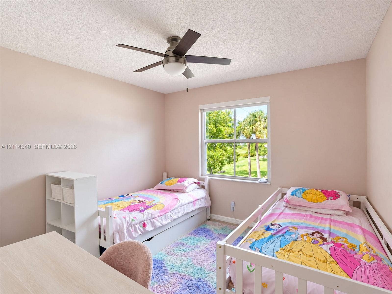 3586 SW 50th Street, Hollywood, FL 33312 Bedroom featuring a brushed nickel ceiling fan with integrated lighting, a single-hung window, and neutral wall paint