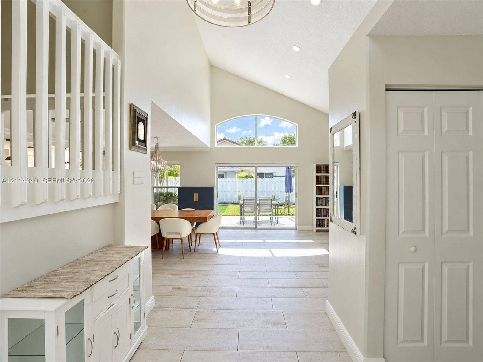 3586 SW 50th Street, Hollywood, FL 33312 Vaulted ceilings, arched window, tile flooring, recessed lighting, and sliding glass doors